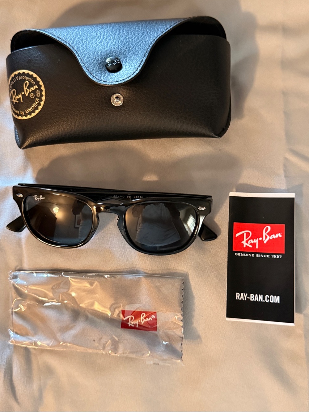 Ray-Ban Sunglasses by Luxottica - Black with Gold Logo